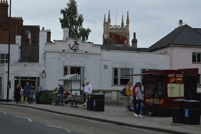 The Anchor pub in Cambridge, with a church tower behind.