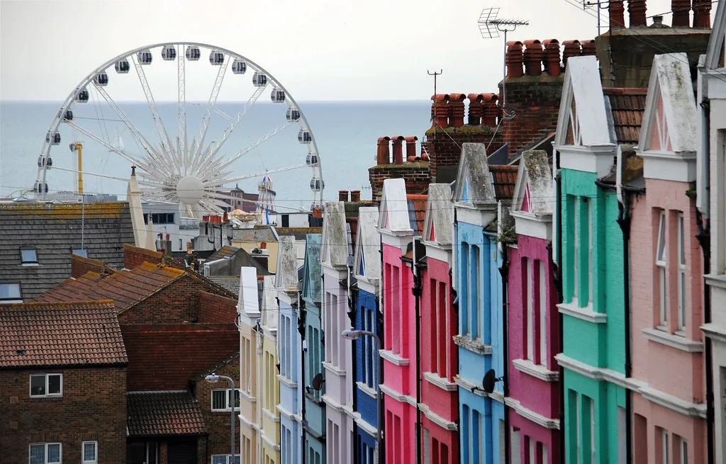 Colourful terraced houses and the Brighton Wheel seen from Baker Street, Brighton.
