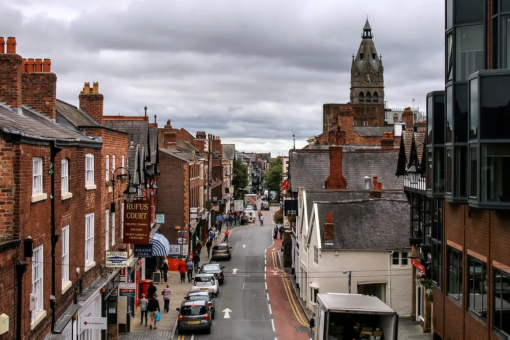 Northgate Street in Chester, with a Gothic tower in the distance.