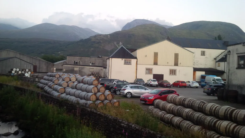Stacked barrels at Ben Nevis Distillery below the hills near Fort William.