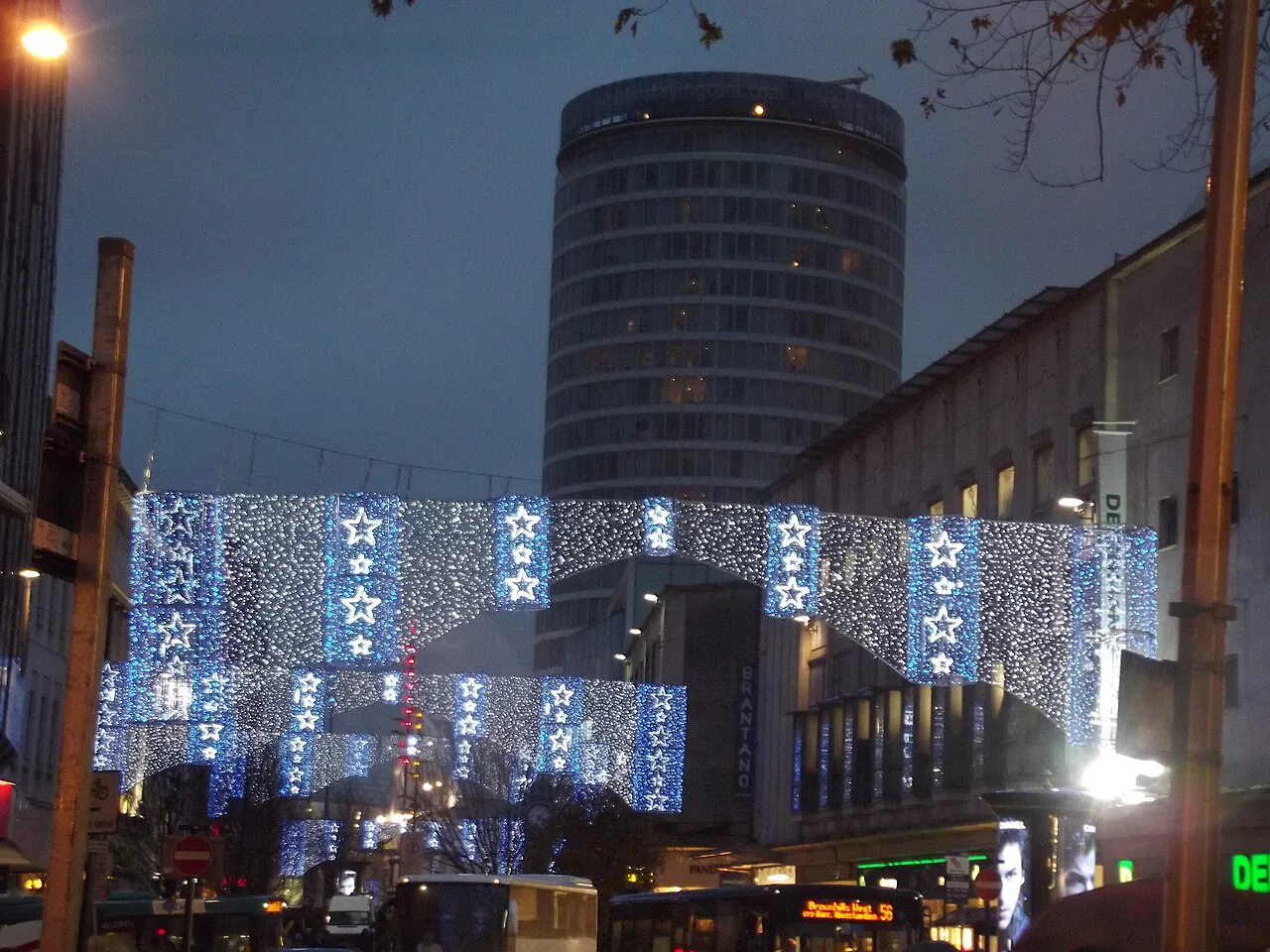 Christmas lights over High Street, Birmingham, with the Rotunda behind.