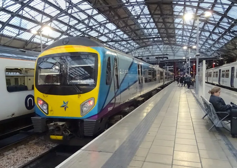 Trains under the arched roof of Liverpool Lime Street station.