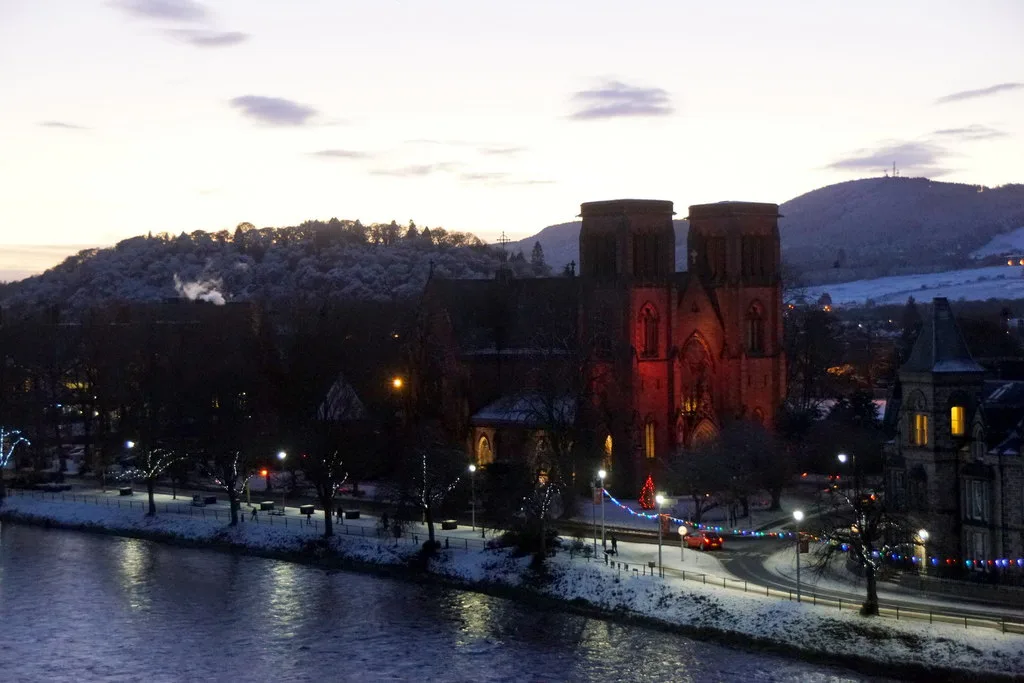 Inverness Cathedral and the River Ness at dusk.