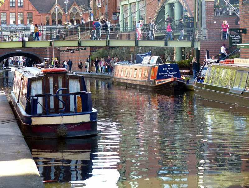 Narrowboats moored on the Worcester and Birmingham Canal in central Birmingham.