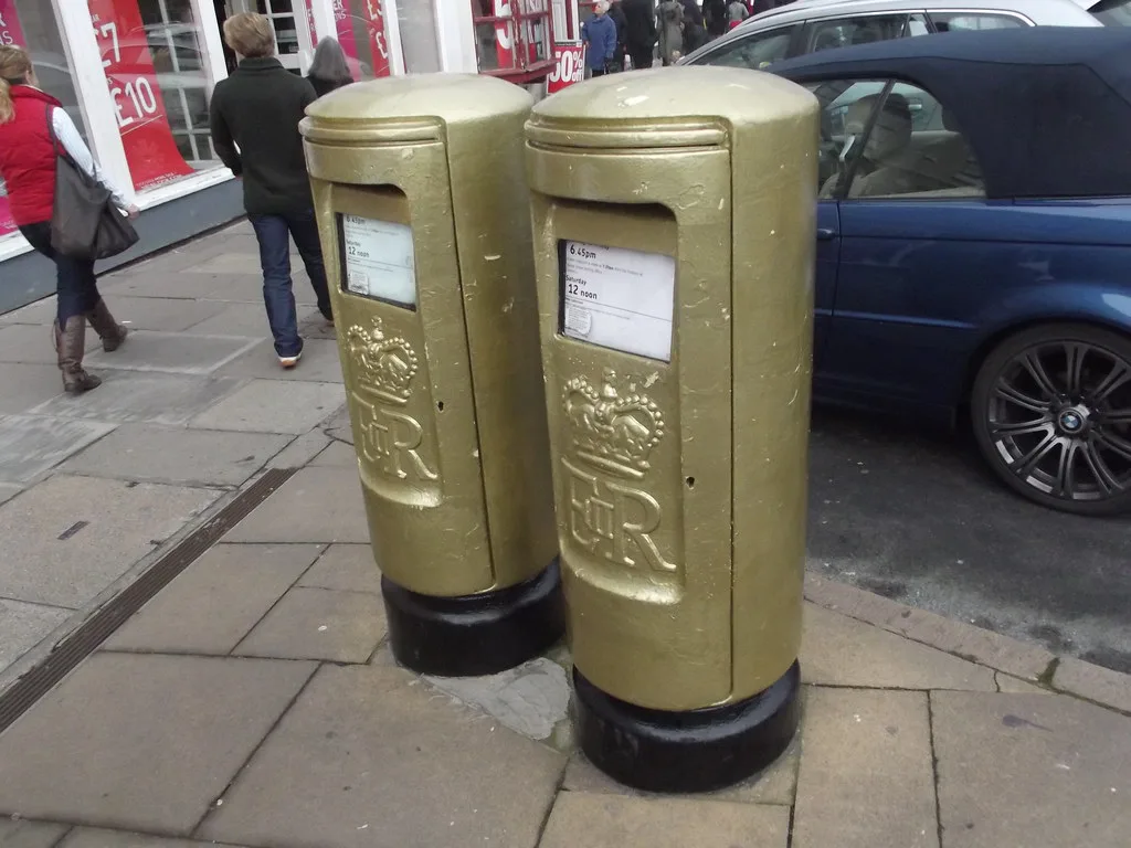 Gold-painted post boxes on Bridge Street, Stratford-upon-Avon.
