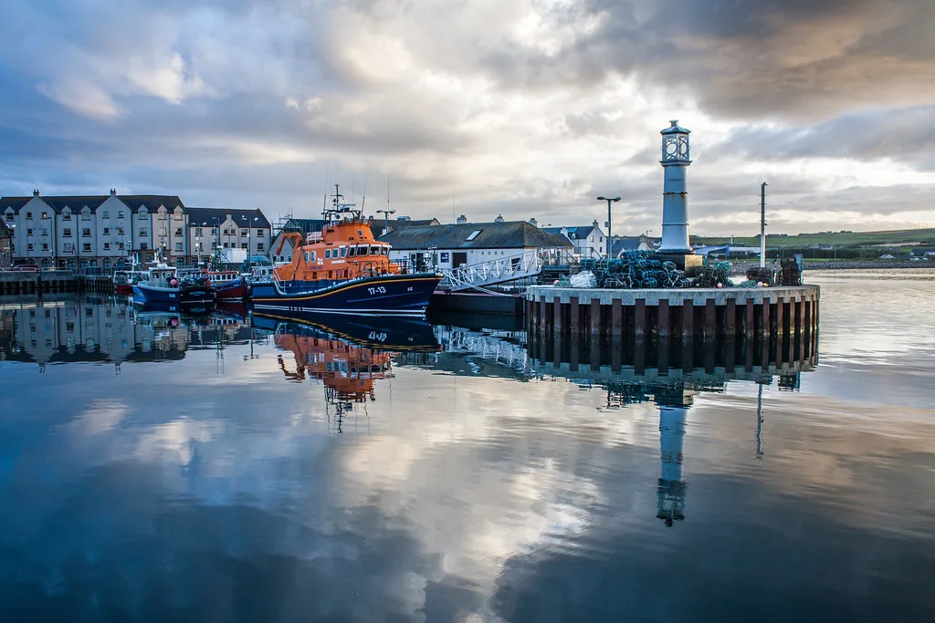 Kirkwall harbour reflecting the evening sky.