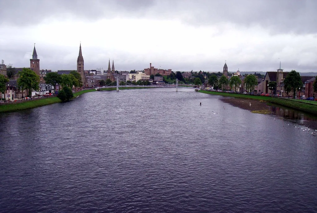 Inverness and its church steeples along the River Ness from Friars Bridge.