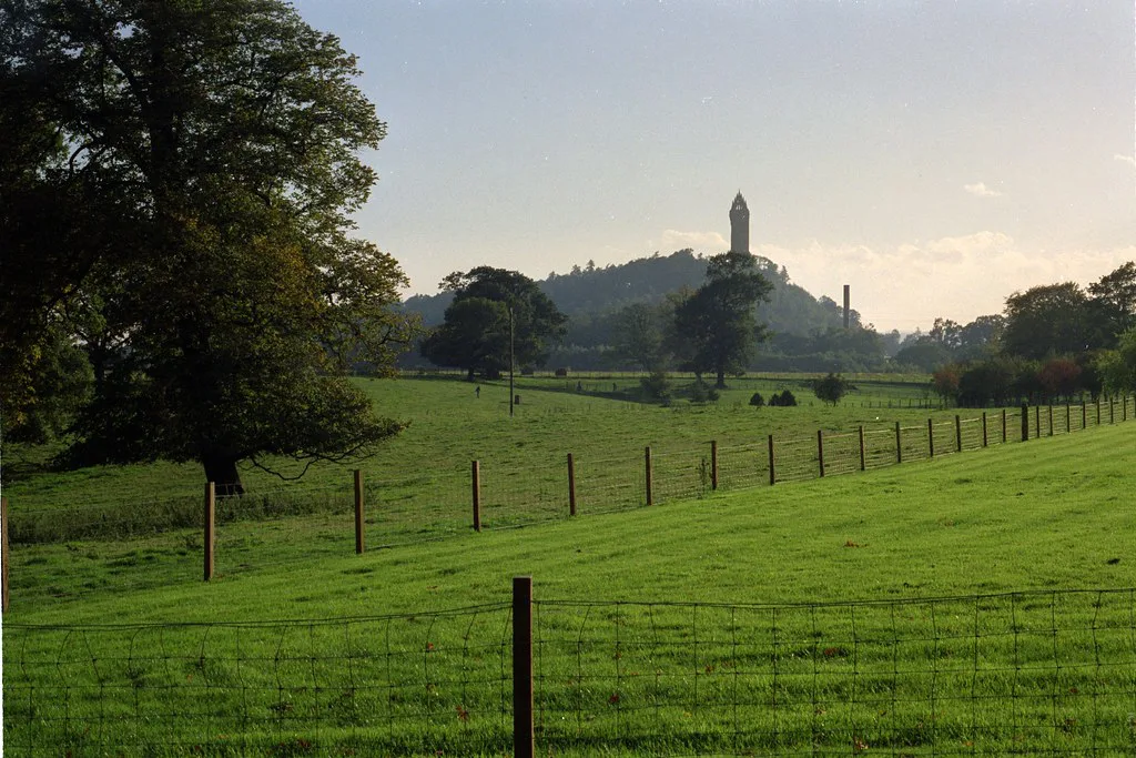 The Wallace Monument seen across fields at Stirling.