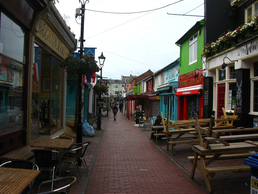 Café tables along a pedestrian lane in the Lanes, Brighton.