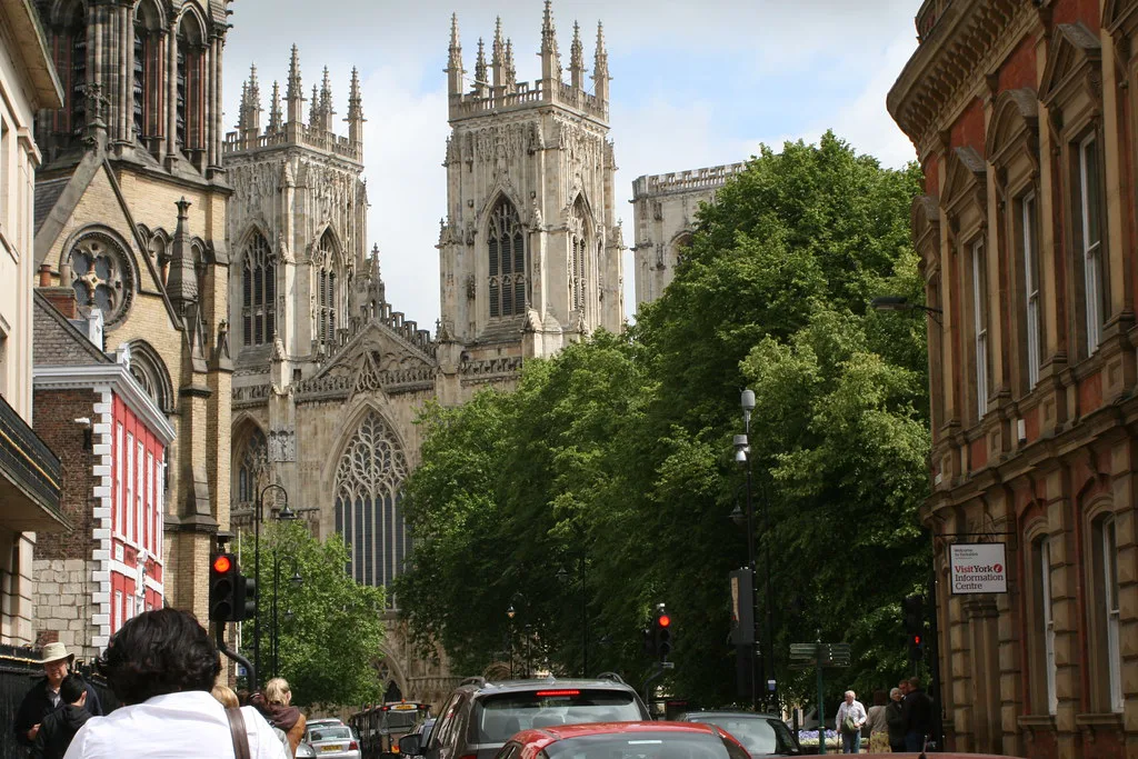 York Minster rising above a street in York city centre.