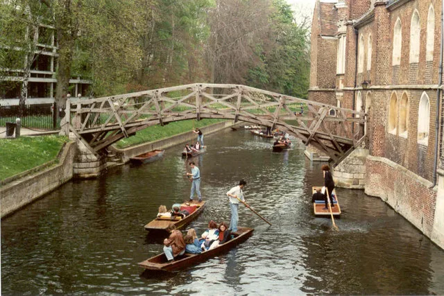 Punts passing under the Mathematical Bridge, Cambridge.
