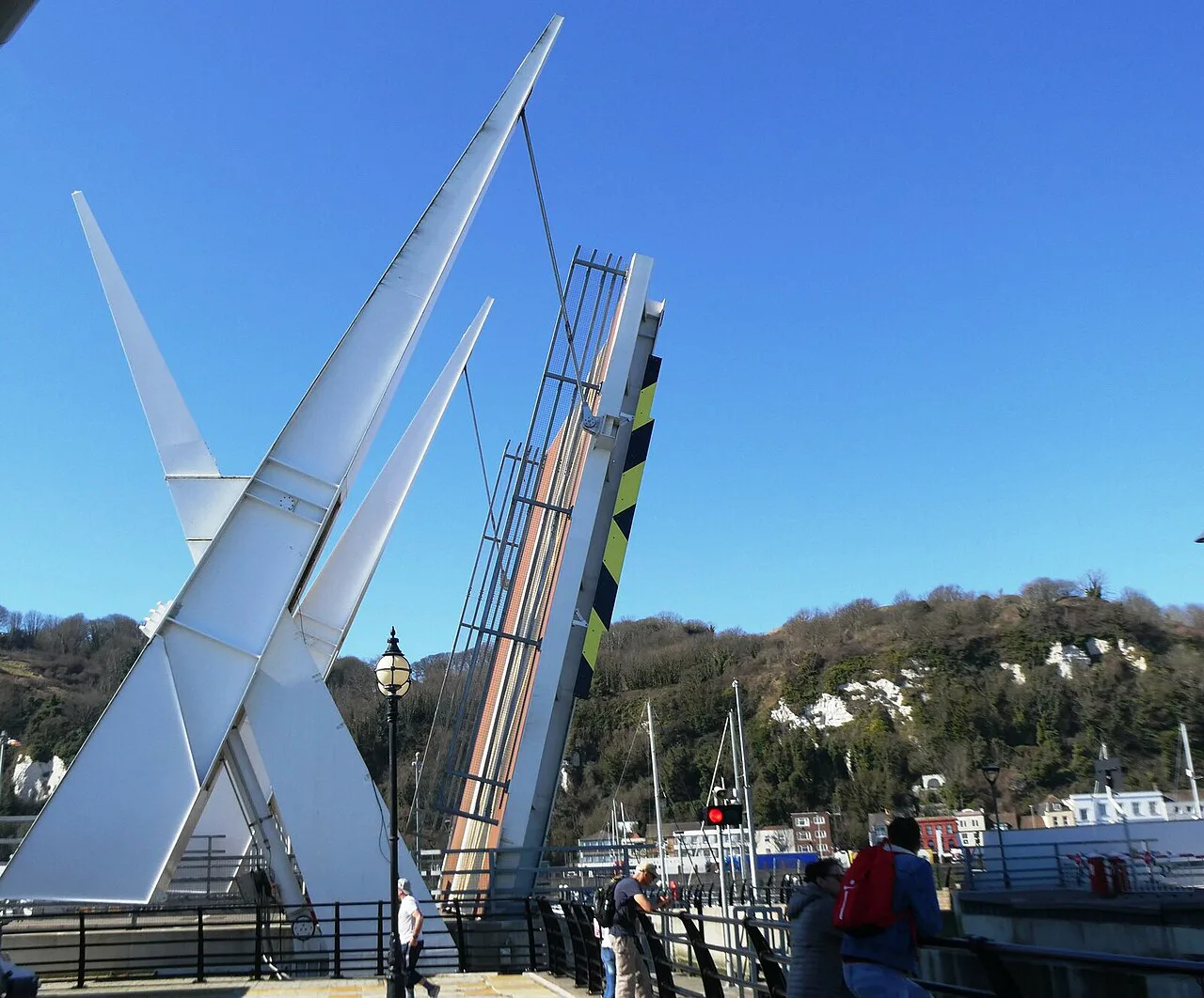 The Bascule Bridge in Dover harbour with the white cliffs behind.
