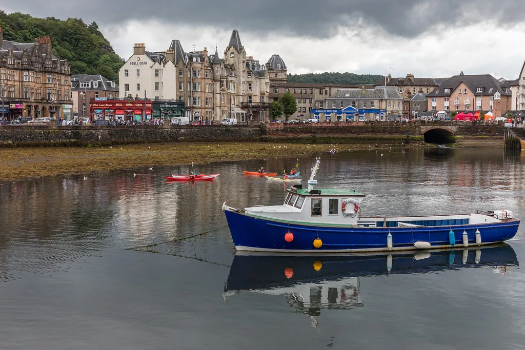 A boat moored off the seafront by the North Pier, Oban.