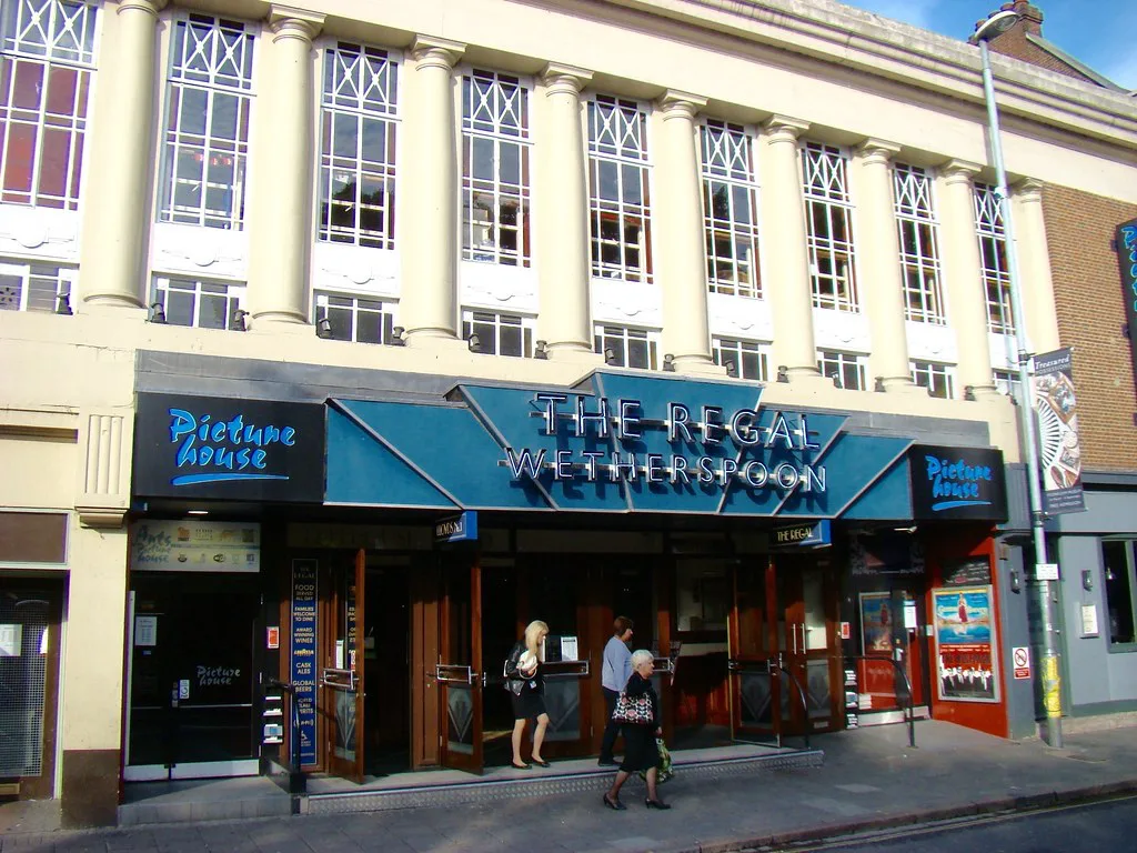 Shopfronts including The Regal in central Cambridge.
