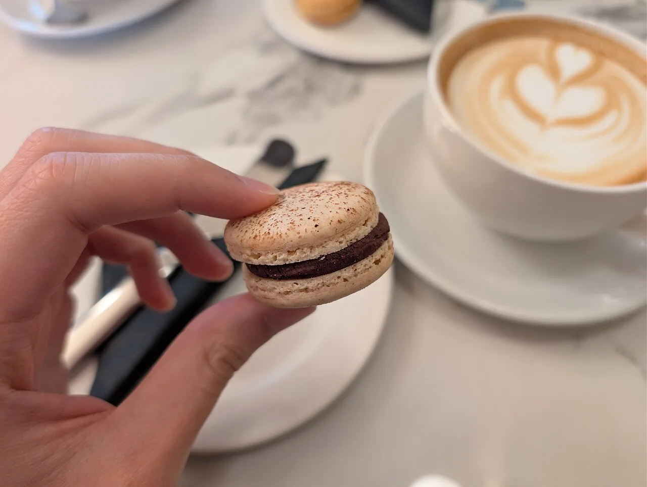 A Black Forest macaron with coffee at Julien Plumart, Brighton.