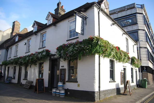The Mill pub with its hanging flower baskets in Cambridge.