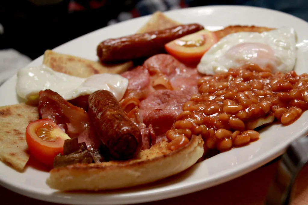 A fried breakfast with sausages, bacon, egg and beans served in Belfast.
