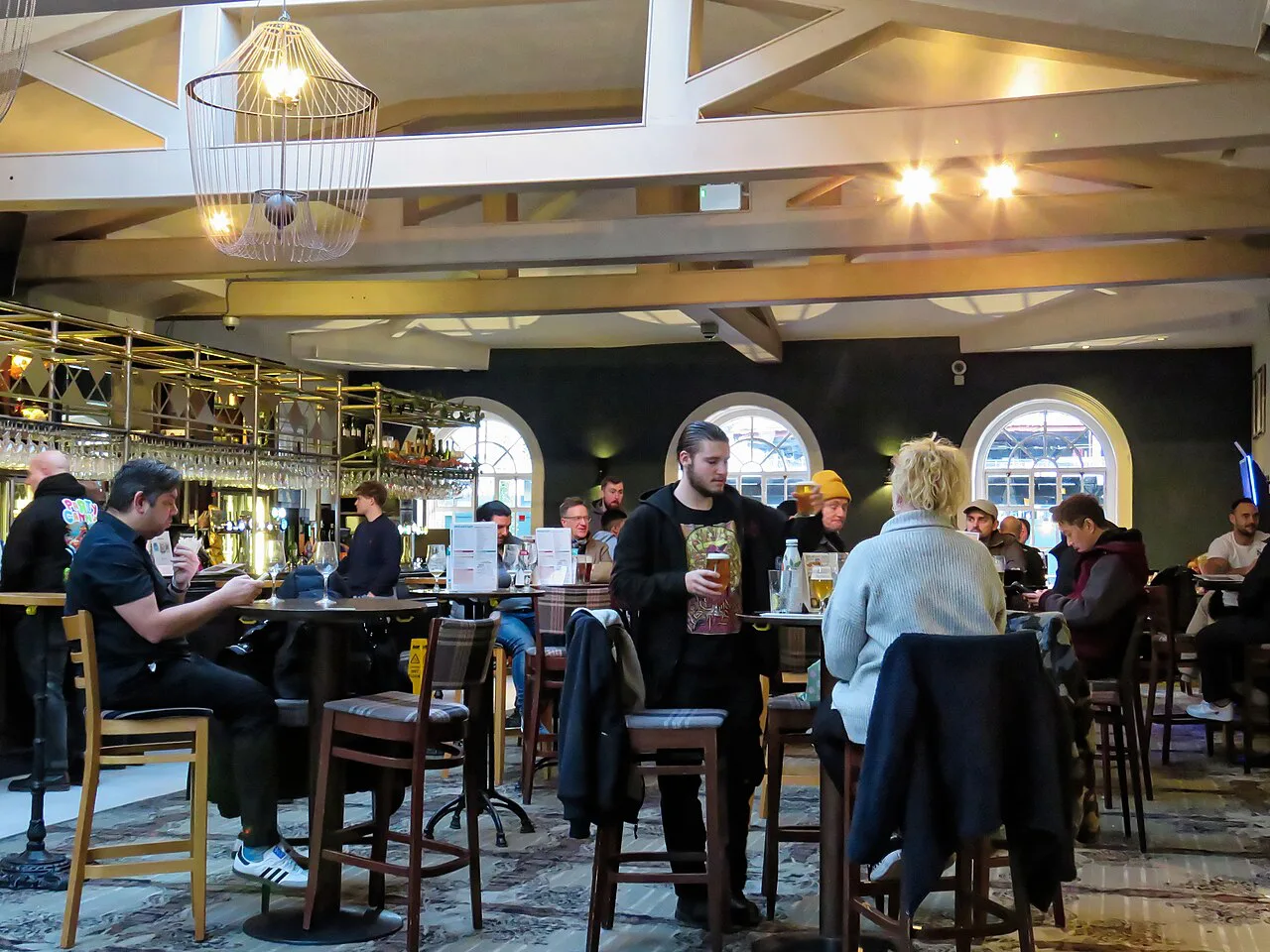 Drinkers inside The Ledger Building pub at West India Quay, London.