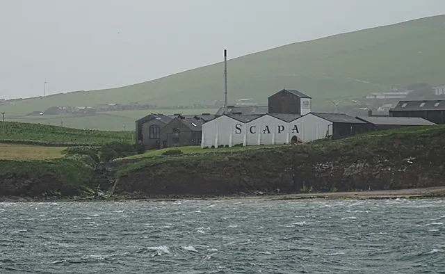 Scapa Distillery seen across the water in Orkney.