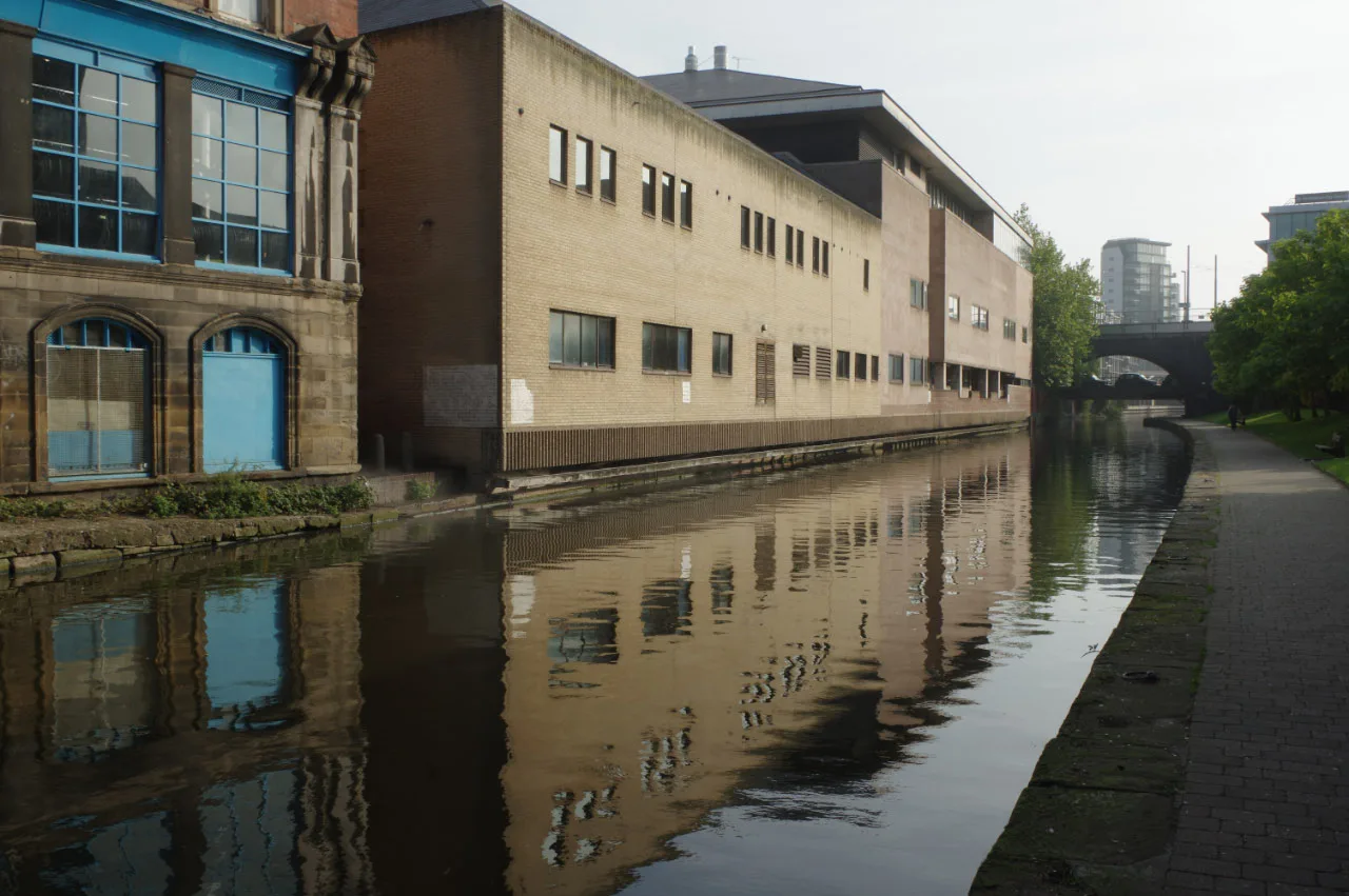 The Nottingham Canal in Nottingham city centre, with the rear of the Crown Courts on the far bank.