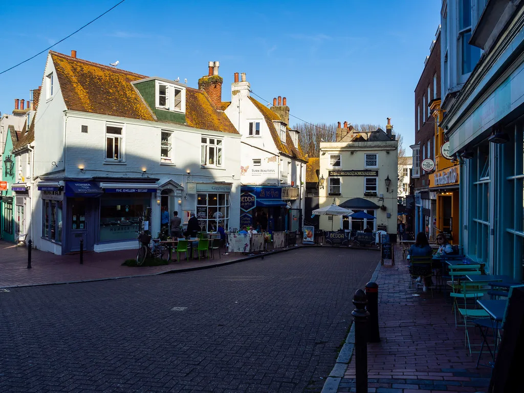 Shops and houses on a street in the Lanes, Brighton.