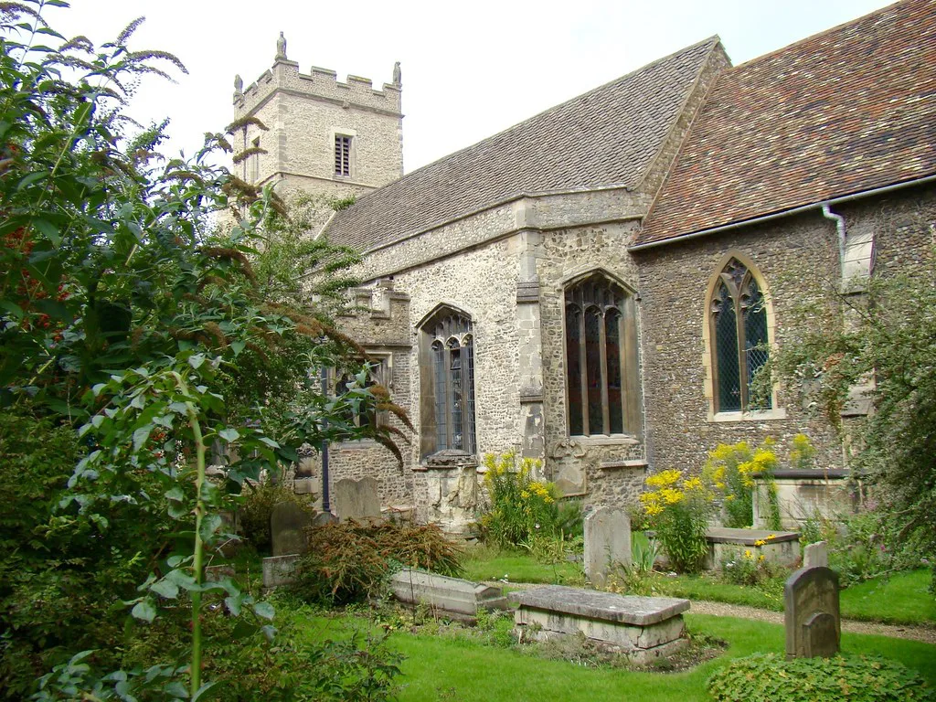 An old stone church and its churchyard in Cambridge.