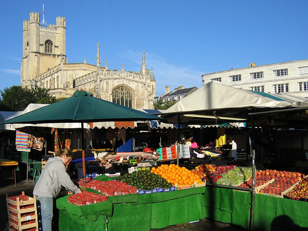 Market stalls on Market Square with Great St Mary's Church behind, Cambridge.