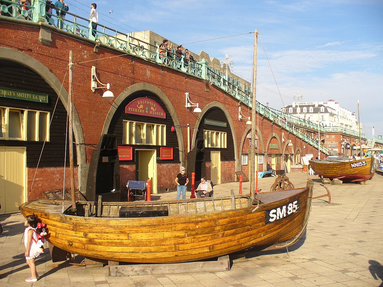 Fishing boats outside the Brighton Fishing Museum on the seafront arches.