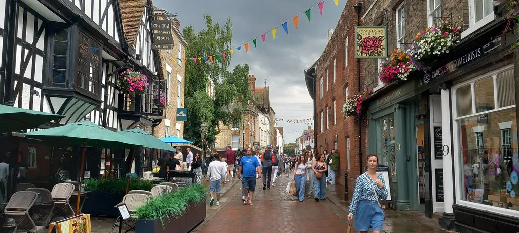 Shops and bunting on the High Street, Canterbury.