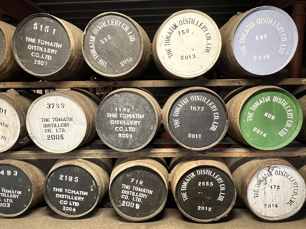 Whisky casks ageing at Tomatin Distillery near Inverness.