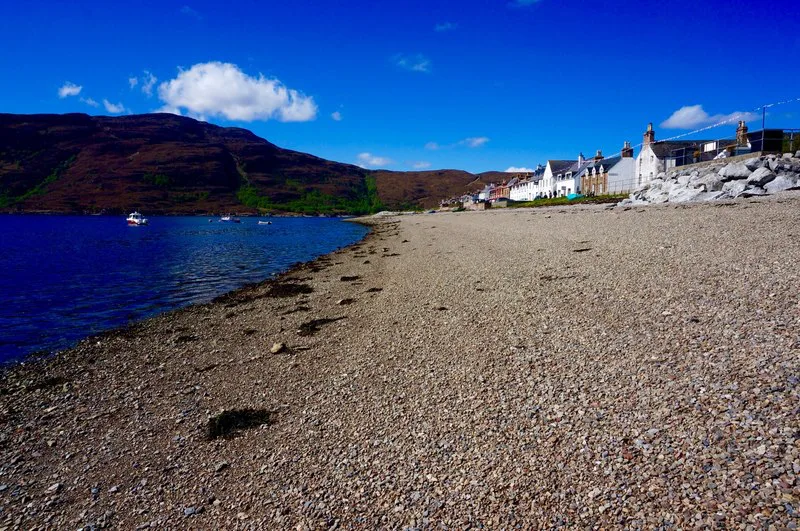 Ullapool beach with the village behind.