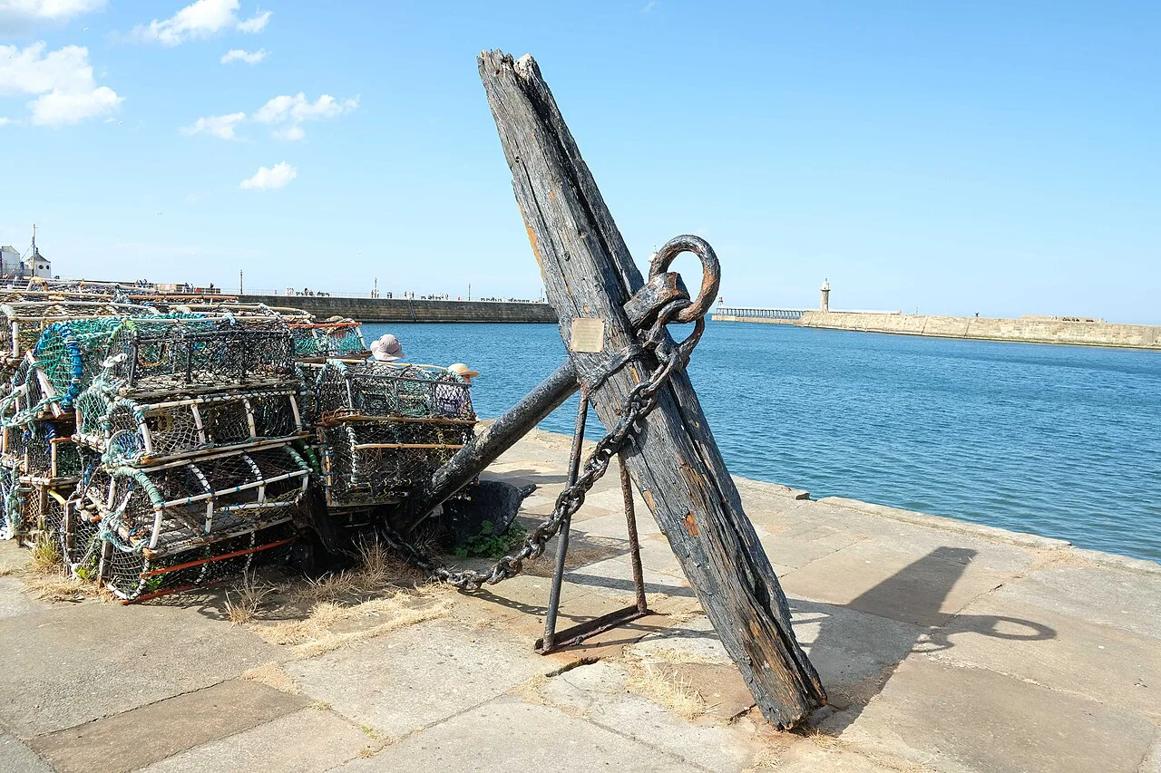 An old anchor and lobster pots on Tate Hill Pier, Whitby.