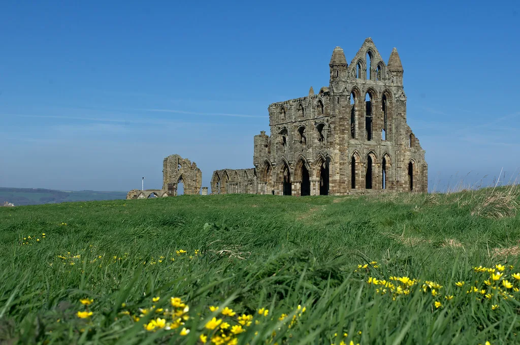 Whitby Abbey on the clifftop above the town.