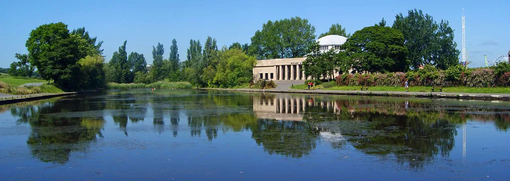 The lake and Palace of Arts building in Exhibition Park, Newcastle upon Tyne.